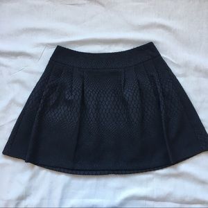 Pleated snake textured mini skirt